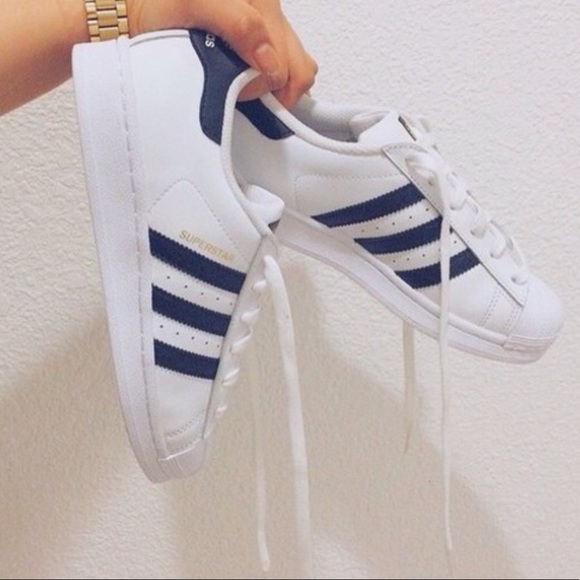 navy and white adidas superstars